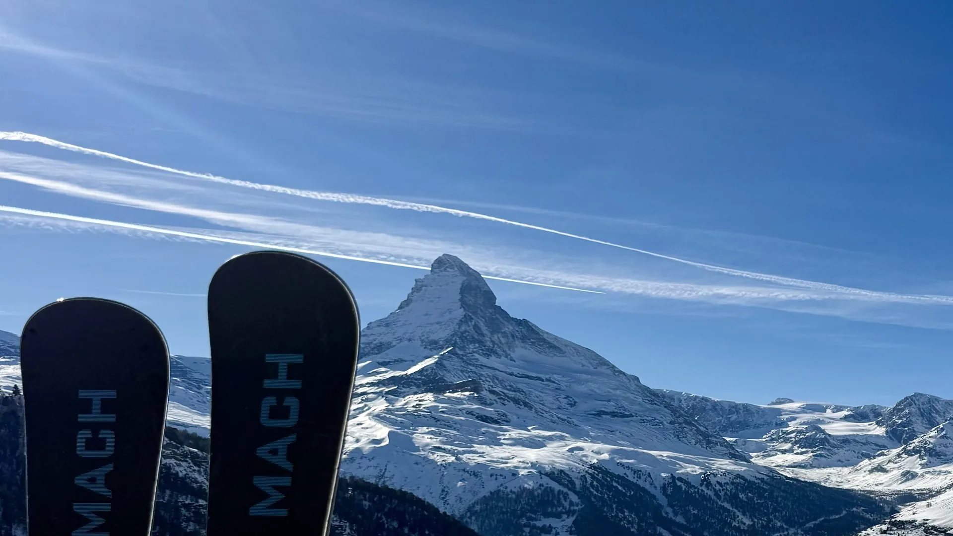 machski-zermatt-jasonleftwrightleft — MACH skis in the snow above Zermatt with the Matterhorn behind